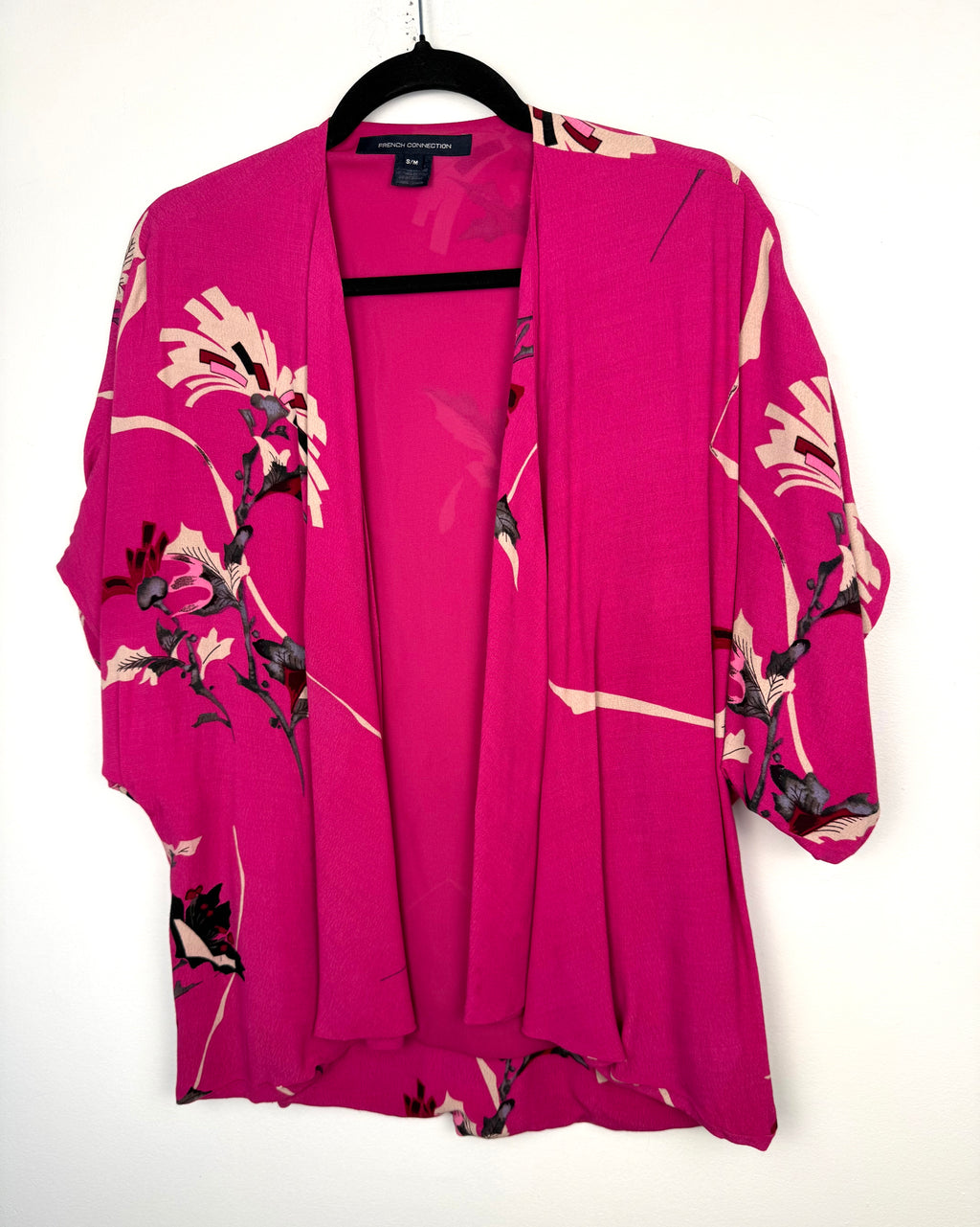 front of French Connection Floral Kimono | Romantic Boho Layering Piece at Blue Sparrow Shop on hanger