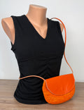 front of Handmade Madagascar 100% raffia orange crossbody bag leather flap   at Blue Sparrow Shop