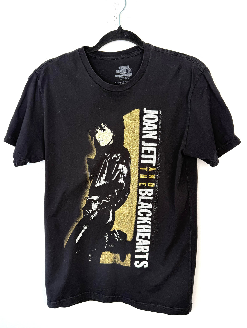 front of Joan Jett and the Blackhearts 100% Cotton Band Tee — Official Merch | Size M at Blue Sparrow Shop on hanger