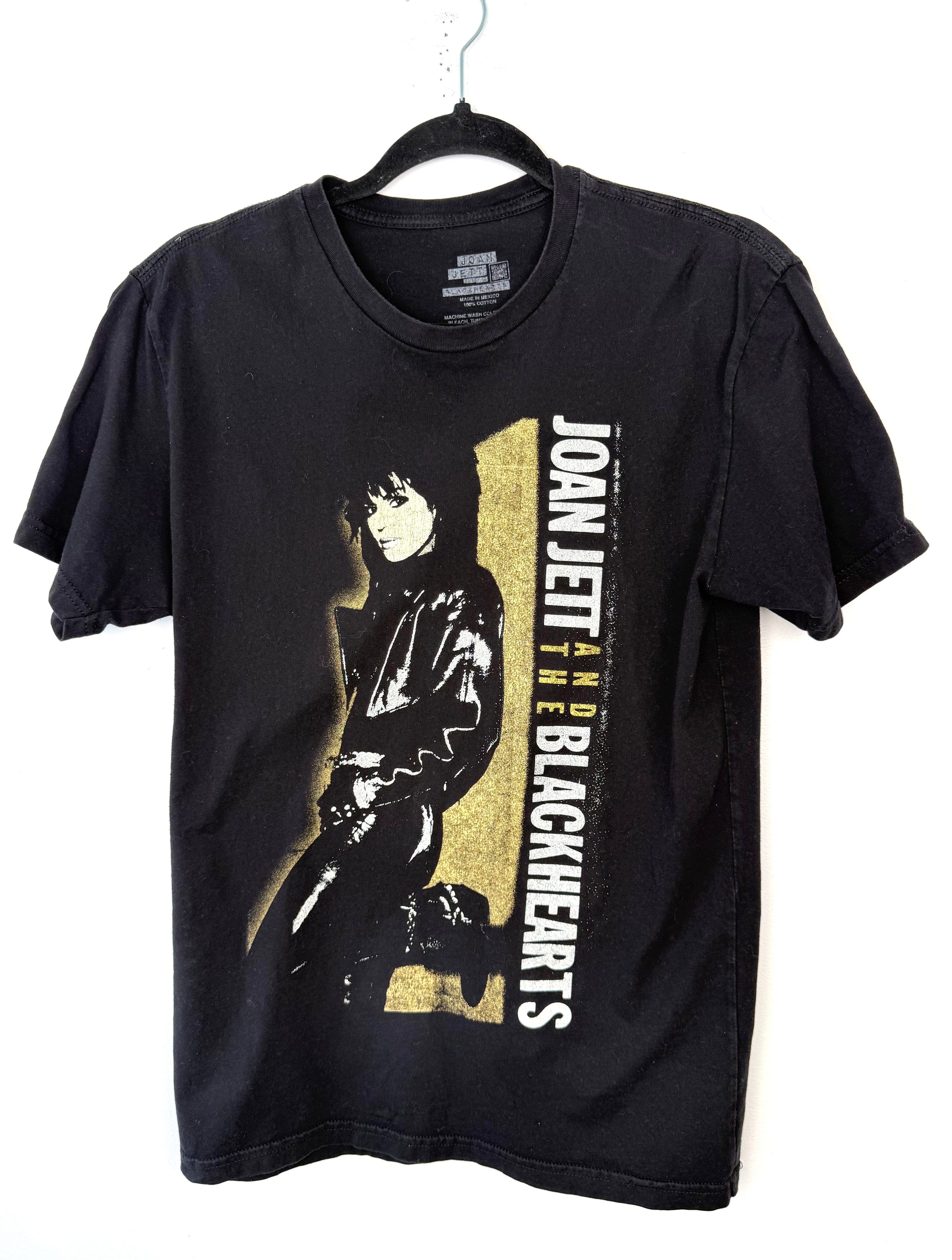 front of Joan Jett and the Blackhearts 100% Cotton Band Tee — Official Merch | Size M at Blue Sparrow Shop on hanger