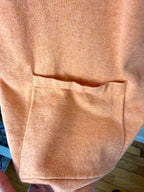 front pocket detail on Marble UK brand knit kimono shawl or lightweight cardigan in peach 