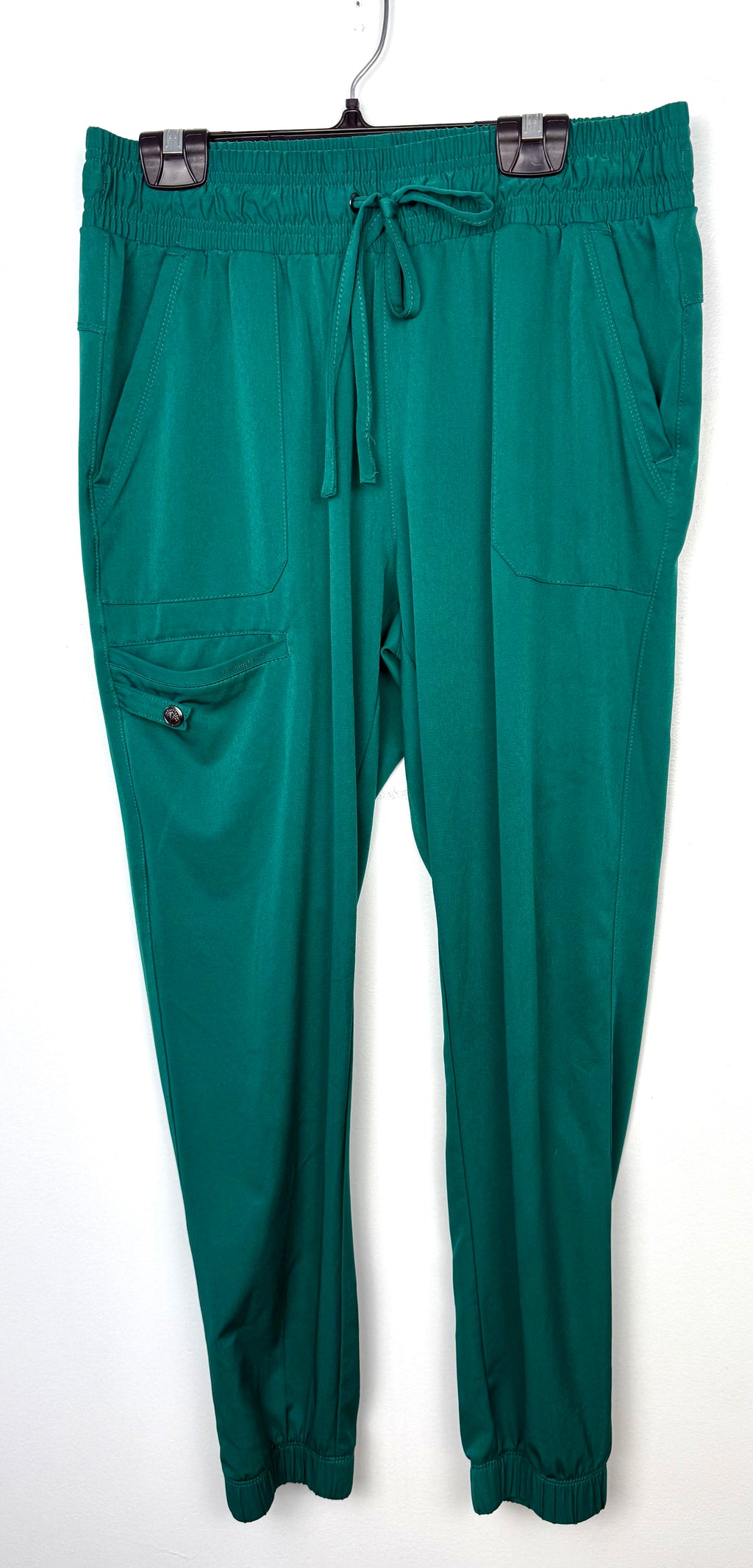 green healing hands scrub pants on hanger