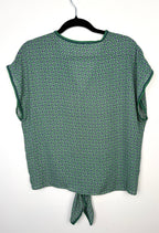 green patterned short sleeve blouse back view lightweight women’s summer top back view on hanger
