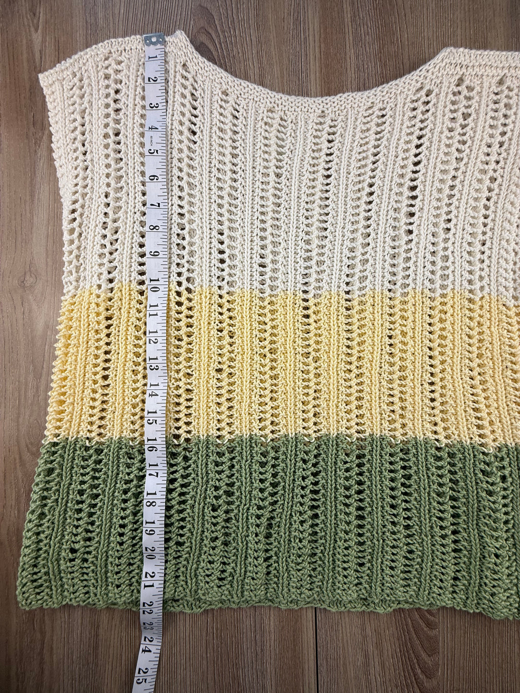 handknit top measuring 22" shoulder to hem 