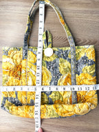 handmade artisan quilted cotton bag measuring 13" wide and 10" deep with 7" handles 