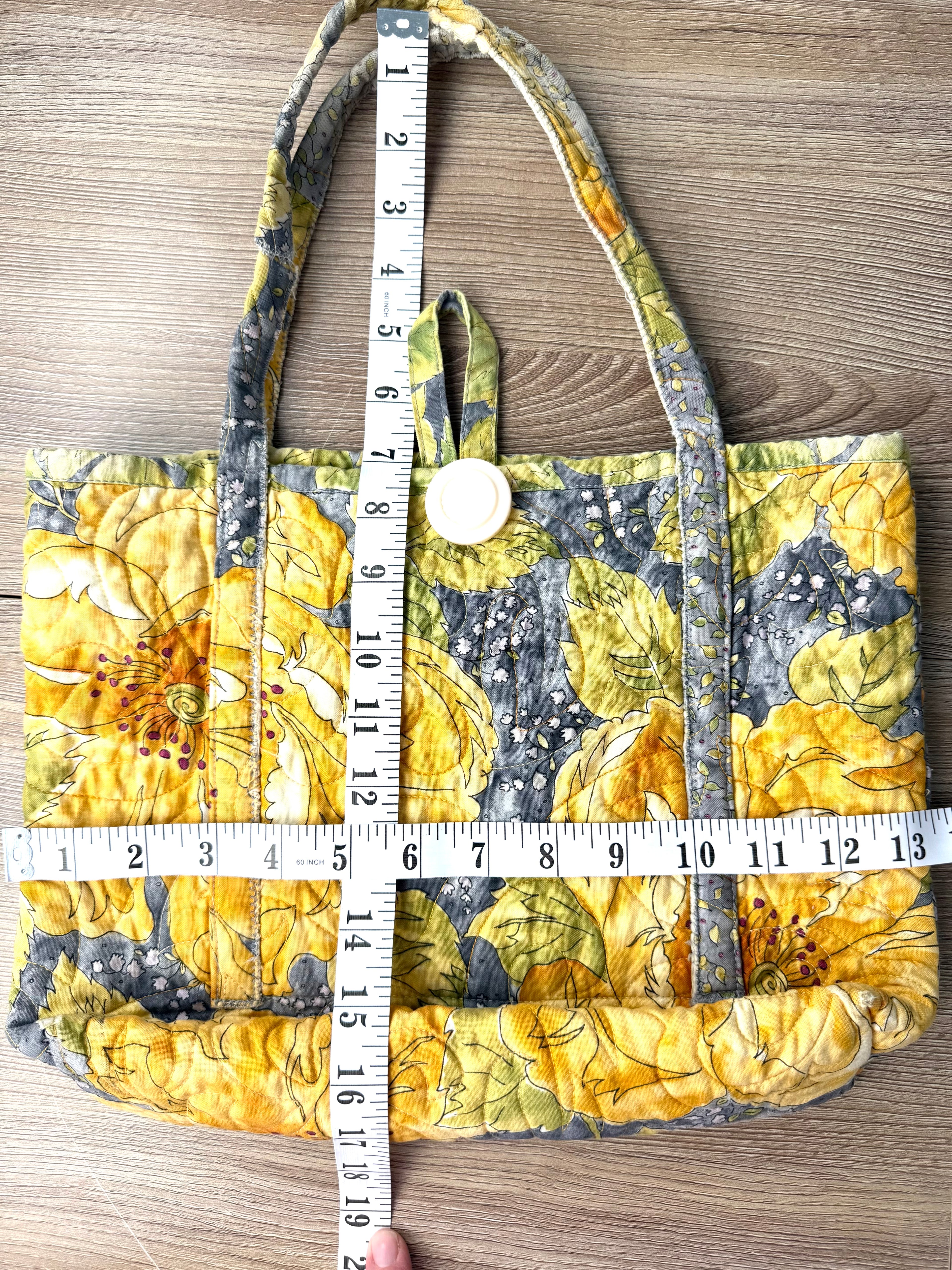 handmade artisan quilted cotton bag measuring 13" wide and 10" deep with 7" handles 
