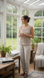 handmade crochet top scalloped hem neutral layering piece at Blue Sparrow Shop  on woman looking out window 