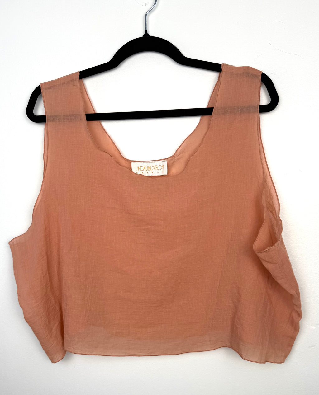 inda lundstrom peach silk crop top on hanger