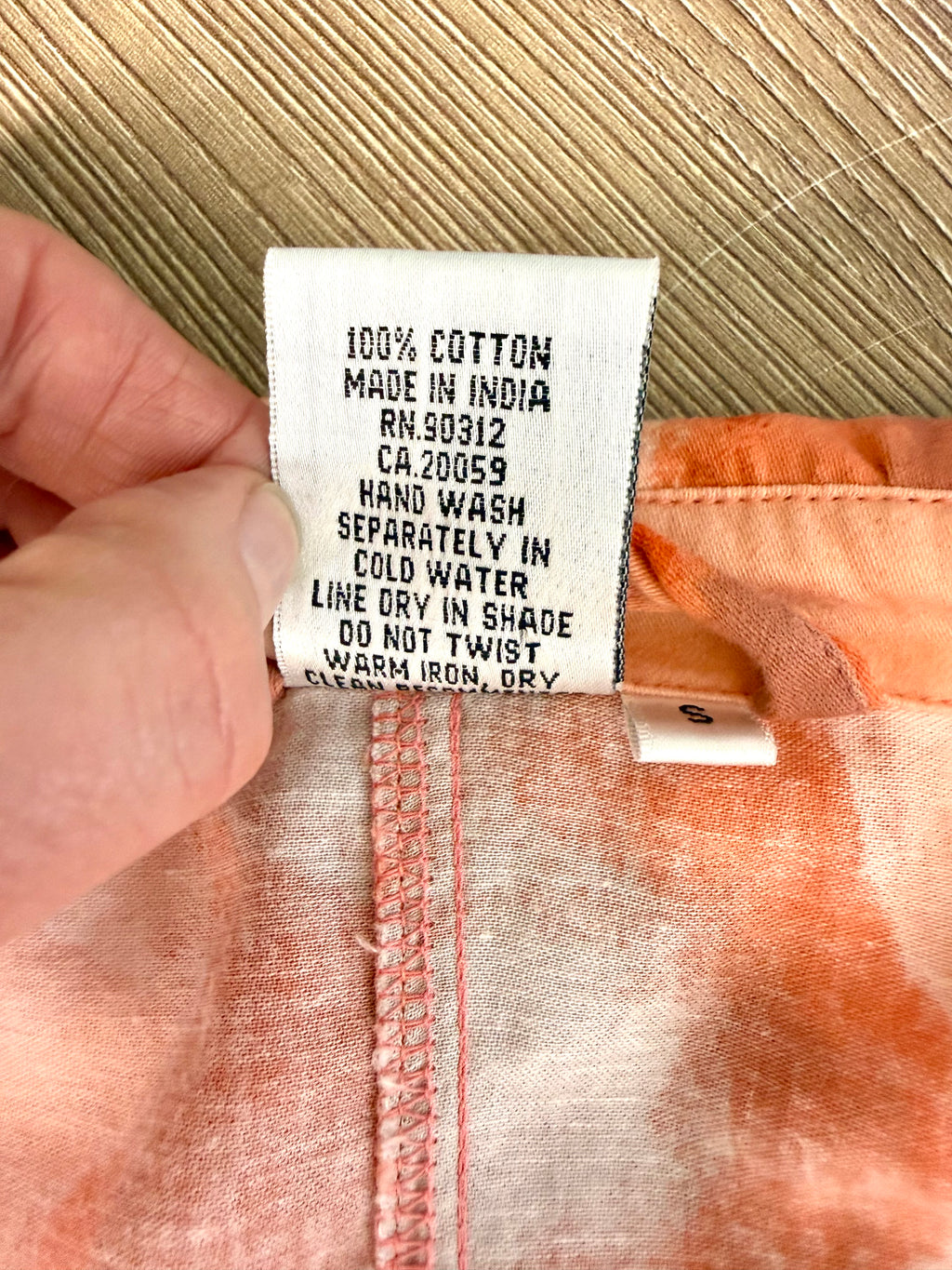 inside care tag on 100% Cotton Parsley & Sage — Peach Abstract Floral Jacket, Size S at Blue Sparrow Shop Canadian Resale Reimagined 