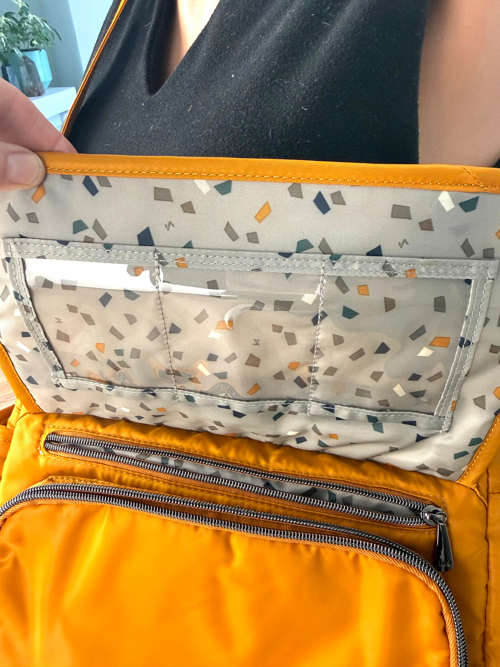 inside flap on front of Lug Wings Travel Cross Body Bag 