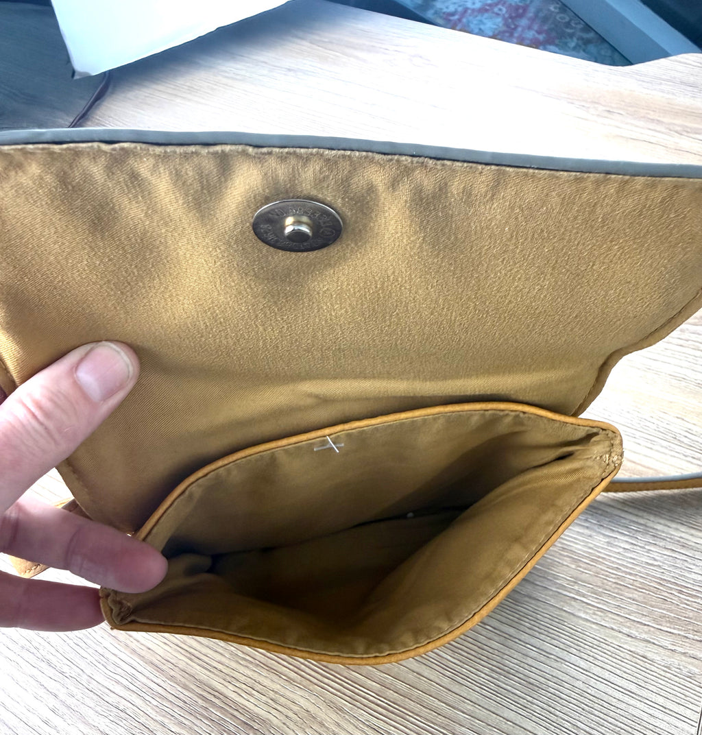 inside front pocket on Vegan Leather Accessorize Mustard Yellow Crossbody Bag 