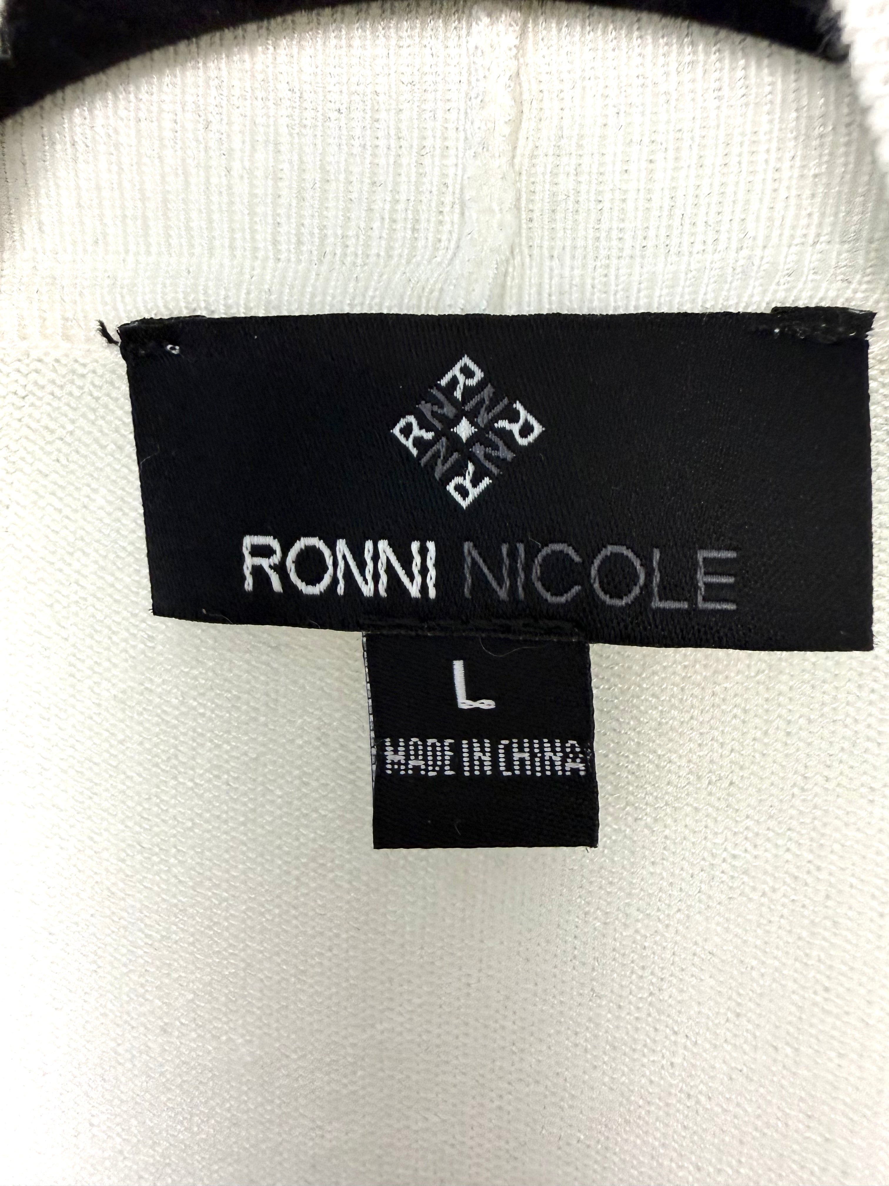 inside hang tag on vory cropped open front cardigan, dressy layering piece for dresses and skirts says Ronni Nicole brand size L made in china 