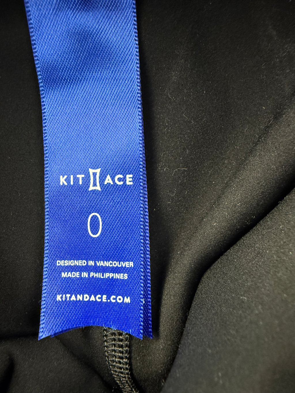inside label Kit and Ace black high-waist biker shorts 