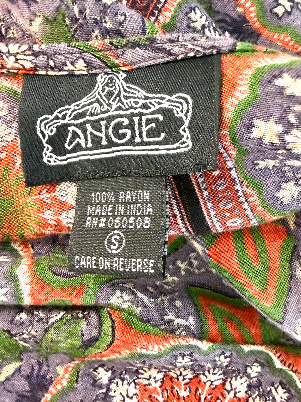 inside label on Angie boho medallion print kimono in earth tones made in India 100% rayon top 