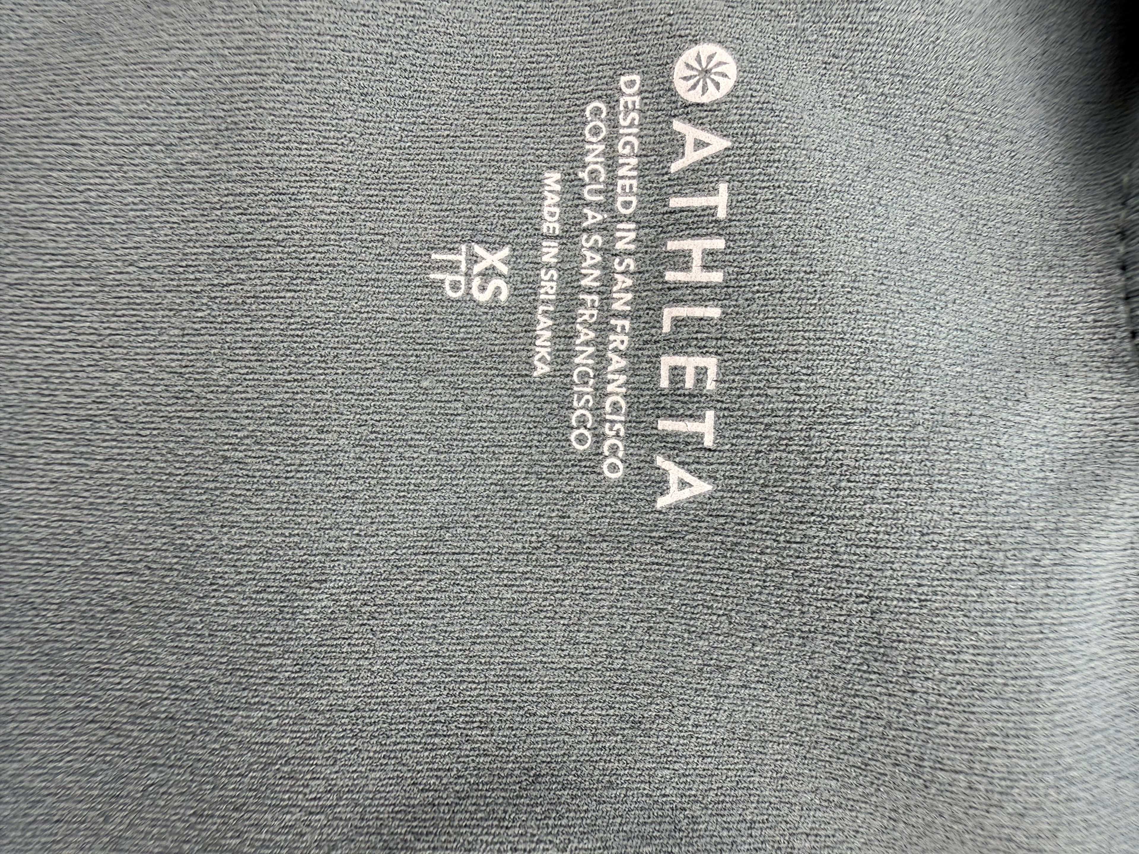 inside label imprinted on Athleta tie dye  Sports Bra Crop Top