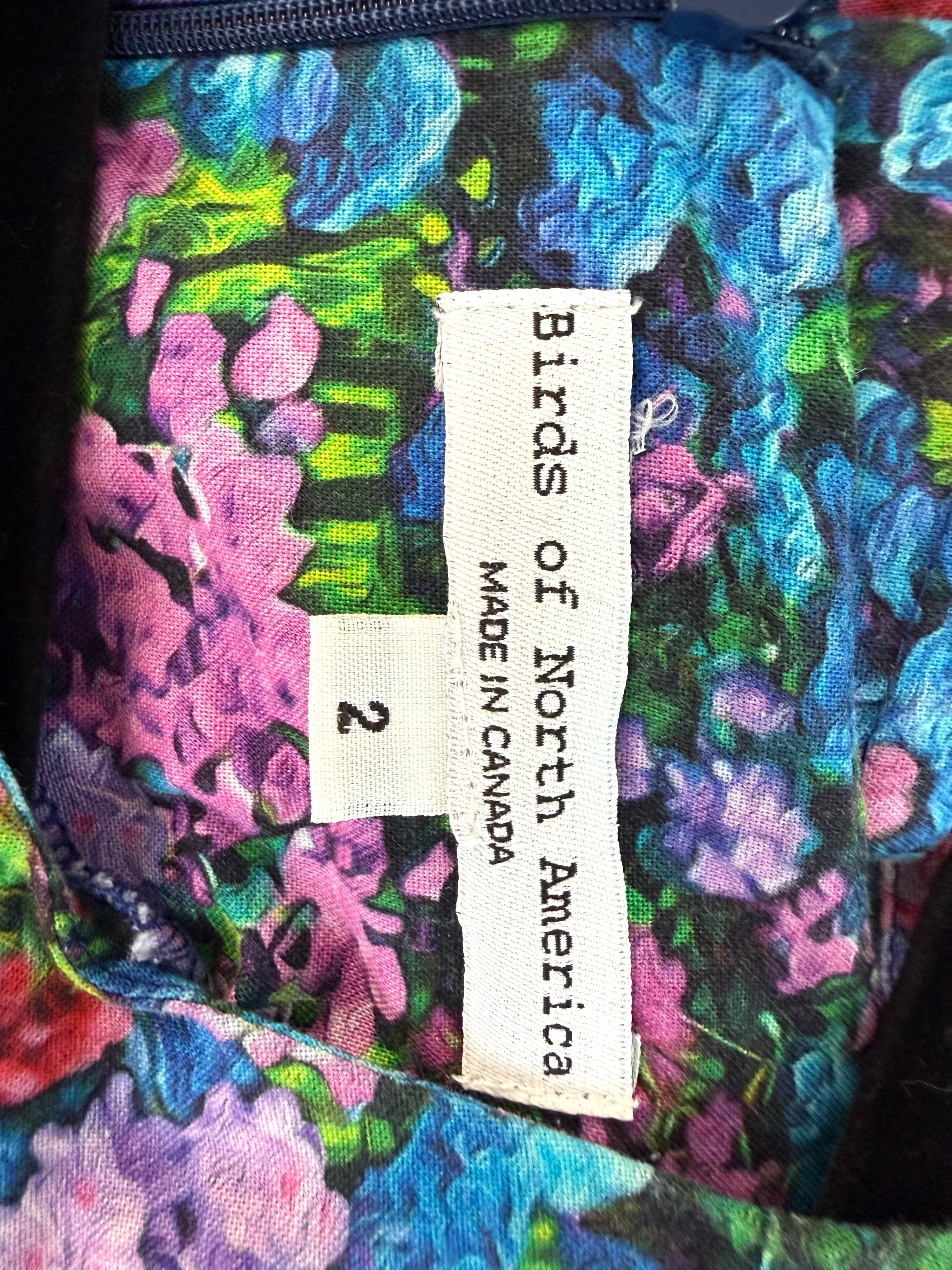 inside label on Birds of North America floral romper with impressionist hydrangea print