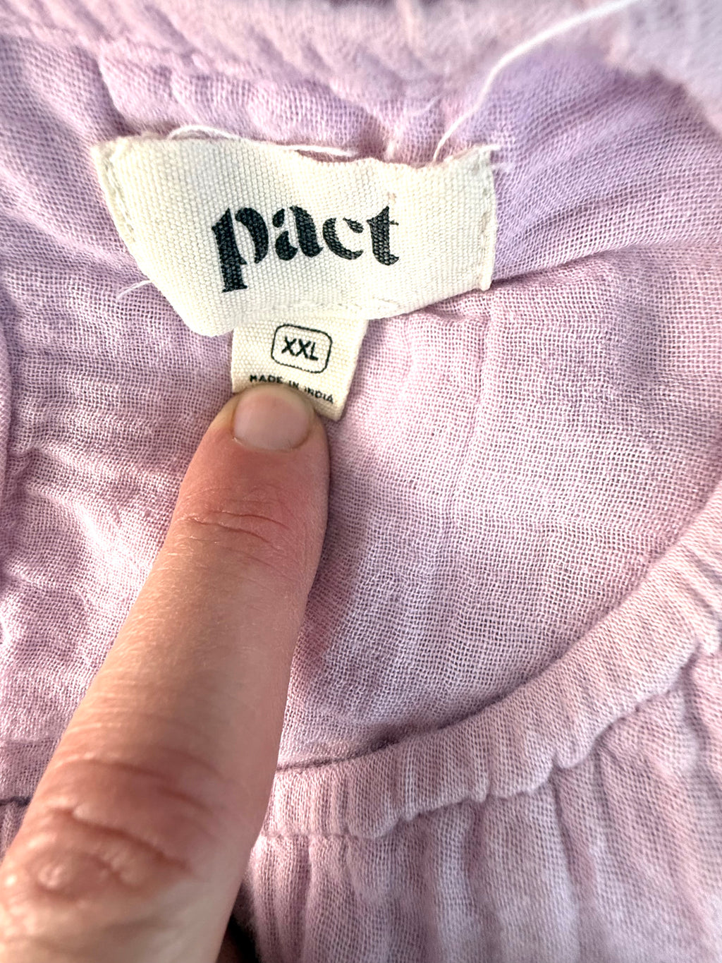 inside label on Pact 100% organic cotton tiered midi dress