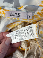 inside labels Made in Italy Boho floral kaftan top with yellow and cream print, crochet V neckline, and tassel hem, lightweight Italian viscose blouse