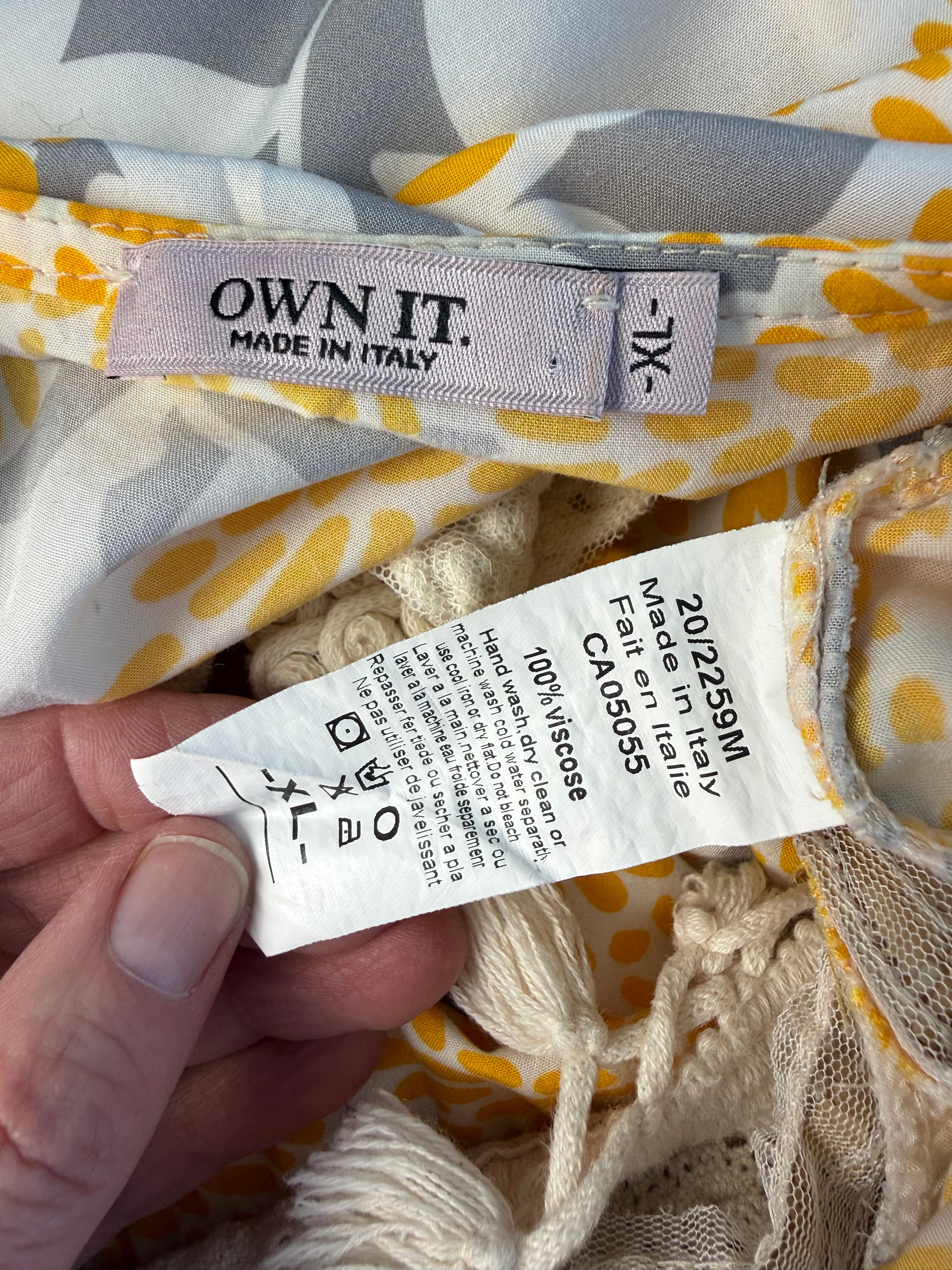 inside labels Made in Italy Boho floral kaftan top with yellow and cream print, crochet V neckline, and tassel hem, lightweight Italian viscose blouse