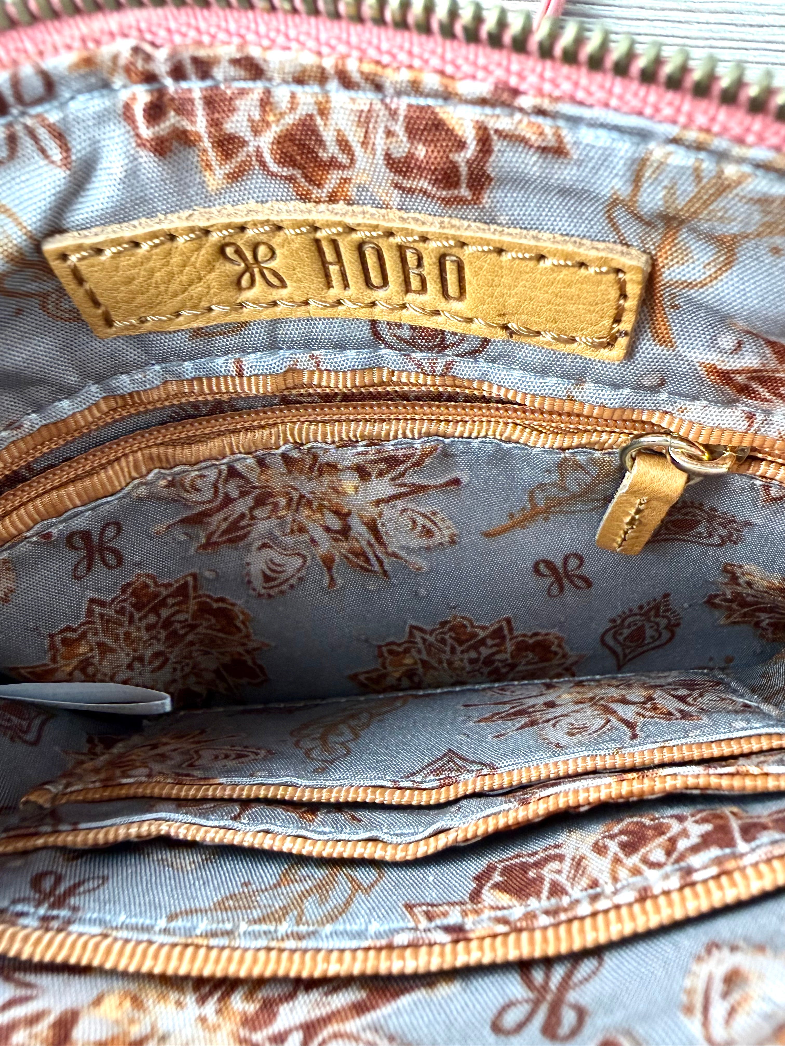 inside of Coral Coloured HOBO International Leather Crossbody Wristlet Bag 