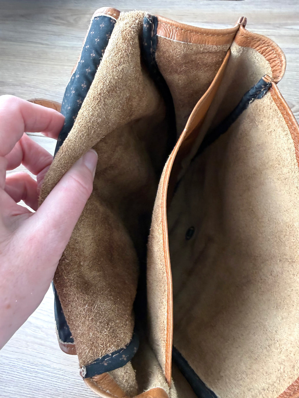 inside of Mesace 1910 Cognac Leather Western Saddle Sling Bag