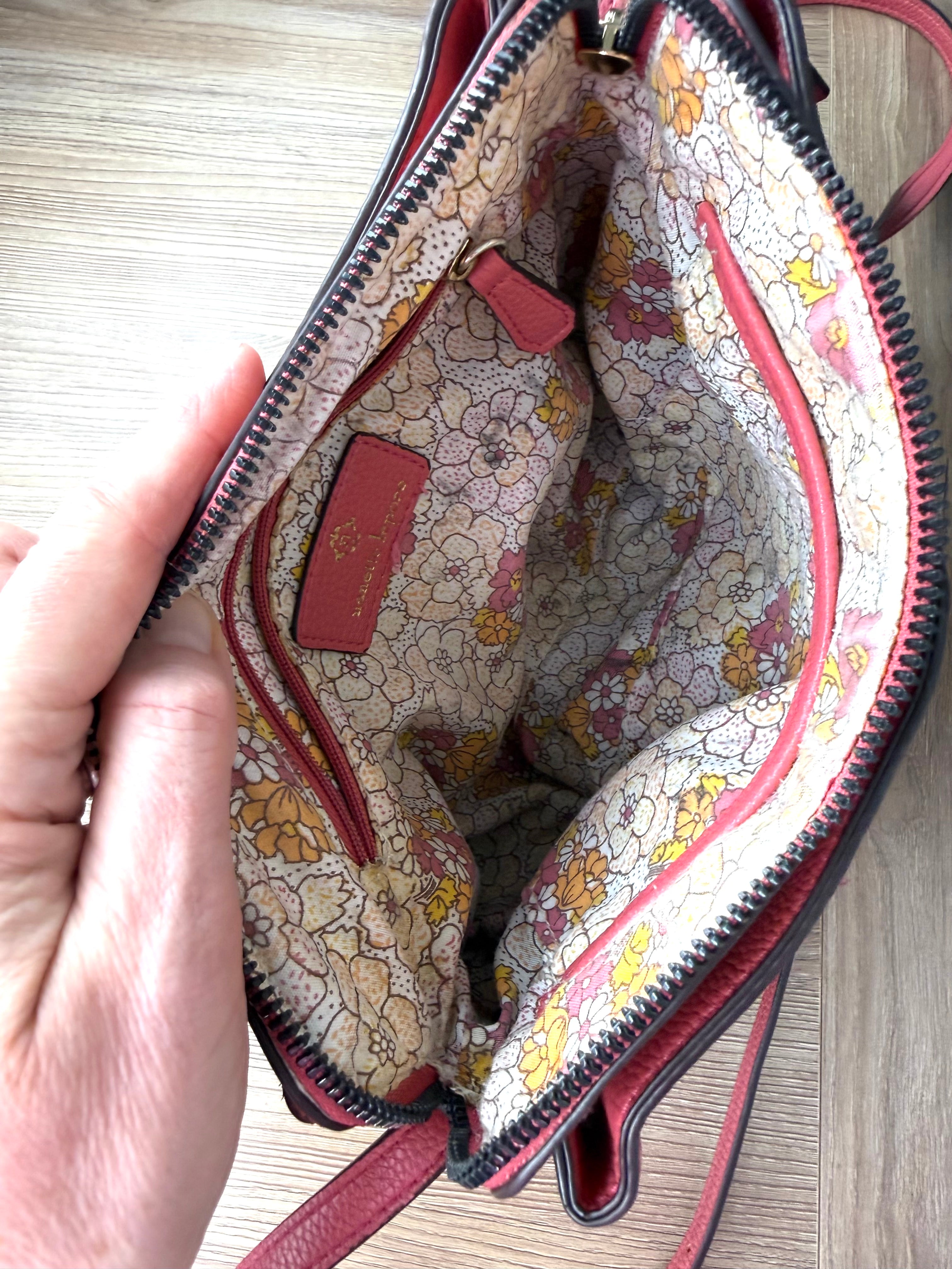 inside of Nanette Lepore Pink Pebbled Leather Crossbody Bag at Blue Sparrow Shop  showing floral lining