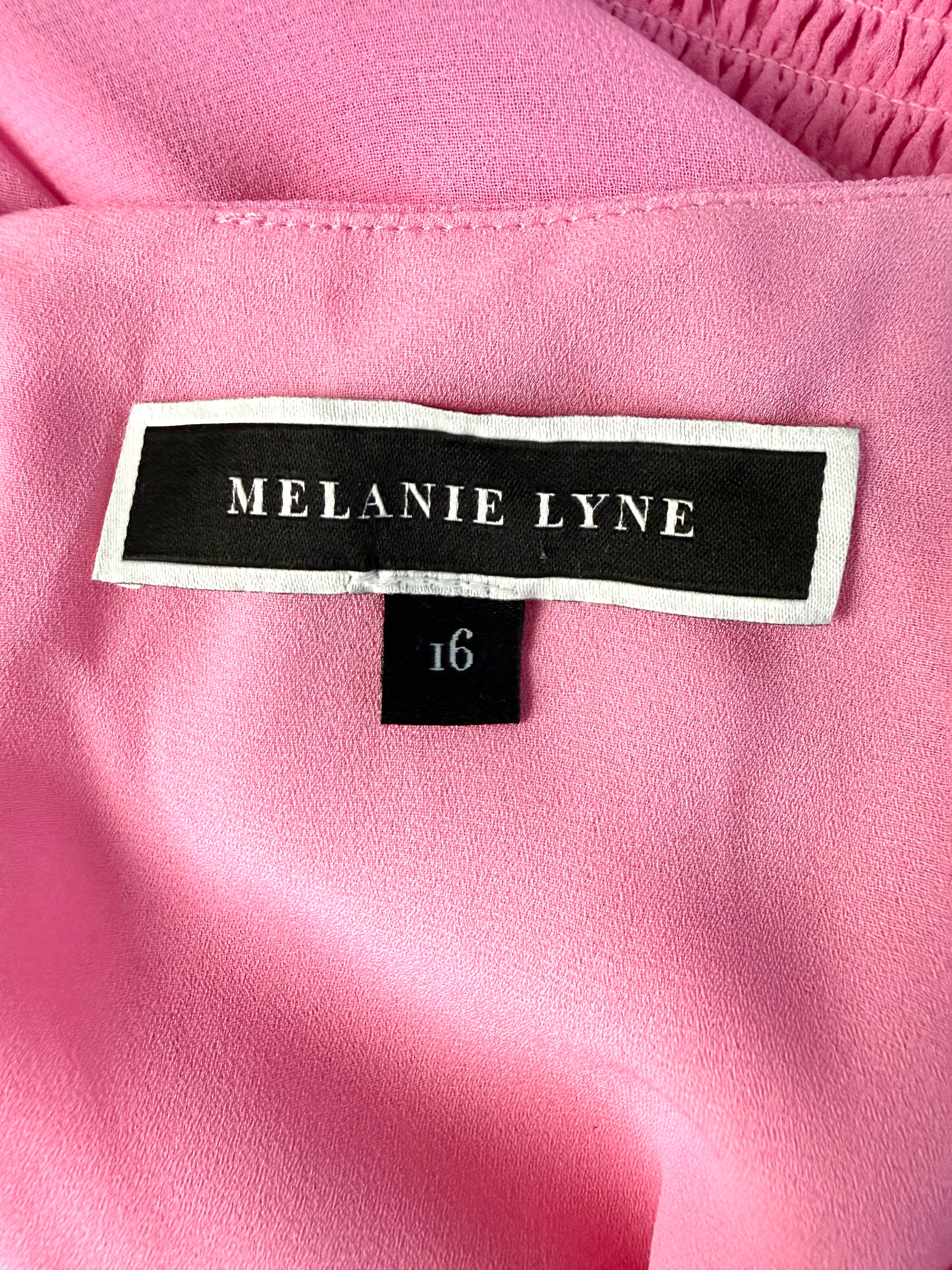 inside tag Melanie Lyne pink chiffon blouse with smocked waist and flutter sleeves