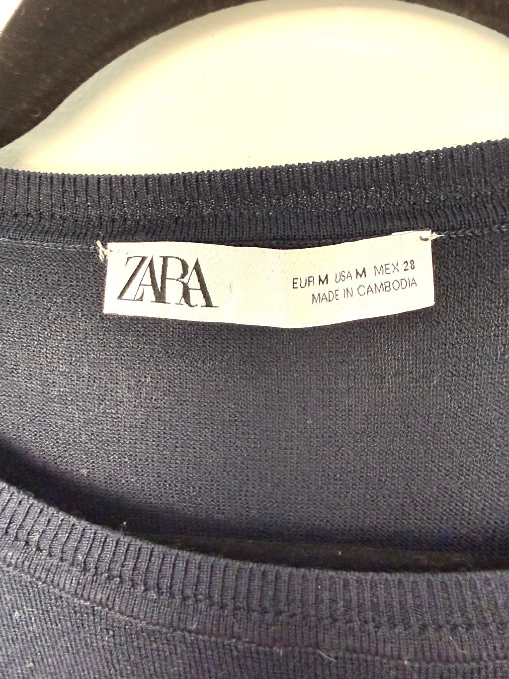 inside tag Zara striped sweater navy and red nautical striped sweater  size medium made in Cambodia