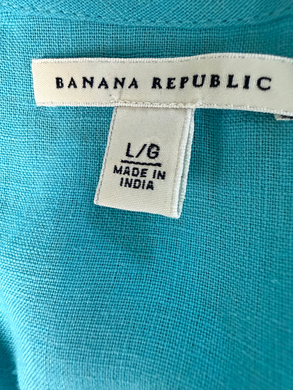 inside tag on Banana Republic 100% Linen Smocked Waist V-Neck Blouse Aqua Coloured | Size L at Blue Sparrow Shop Canadian Resale Reimagined 