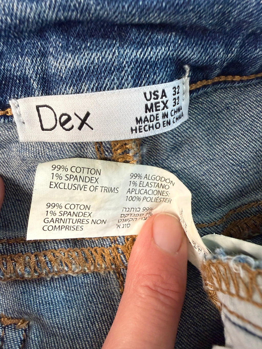 inside tag on Dex embroidered feather skinny jeans medium wash distressed raw hem at Blue Sparrow Shop 