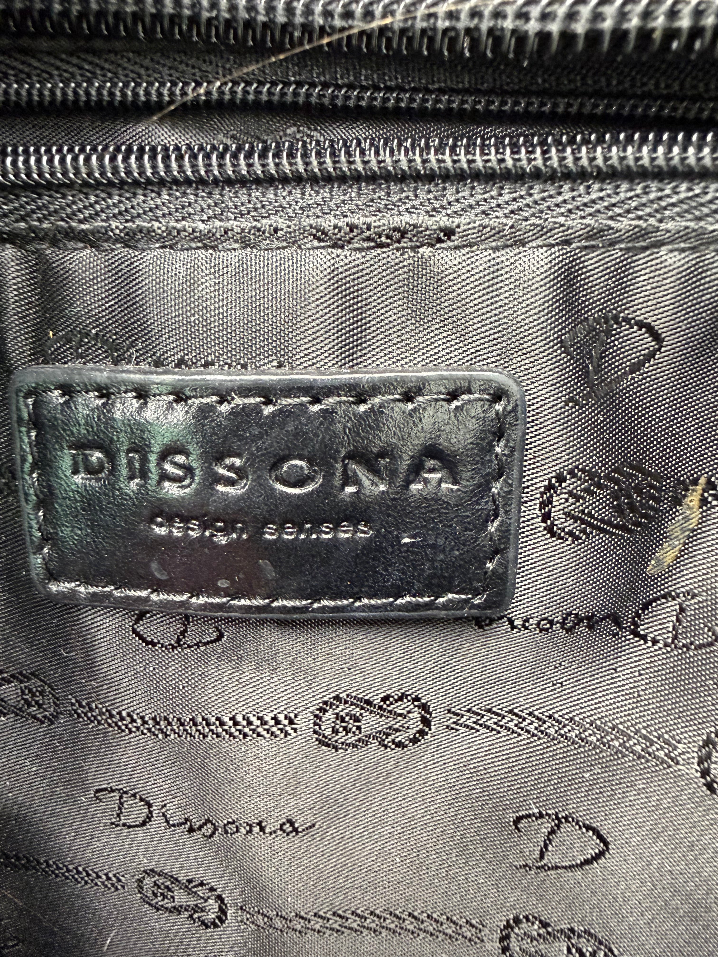 inside tag on Dissona genuine leather black hobo shoulder bag at Blue Sparrow Shop Resale Canada 