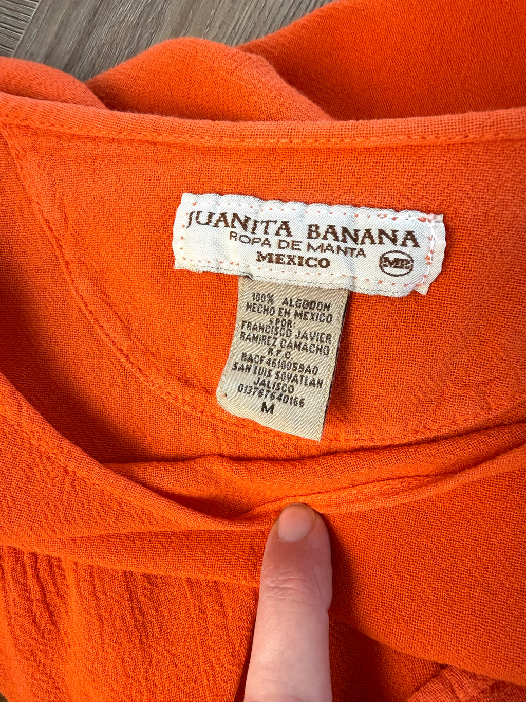 inside tag on Juanita Banana artisan-made Mexican 100% cotton burnt orange batwing peplum top size M — Blue Sparrow pre-loved women's fashion