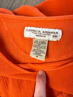 inside tag on Juanita Banana artisan-made Mexican 100% cotton burnt orange batwing peplum top size M — Blue Sparrow pre-loved women's fashion