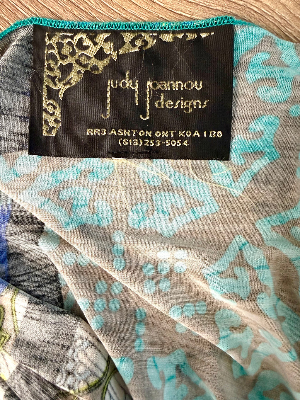 inside tag on Judy Pannou Designs — Canadian Artisan Multi-Print Open Cardigan, Ashton ON  at Blue Sparrow Shop Canadian Resale Reimagined 