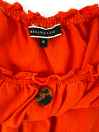 inside tag on Melanie Lyne orange peasant blouse
