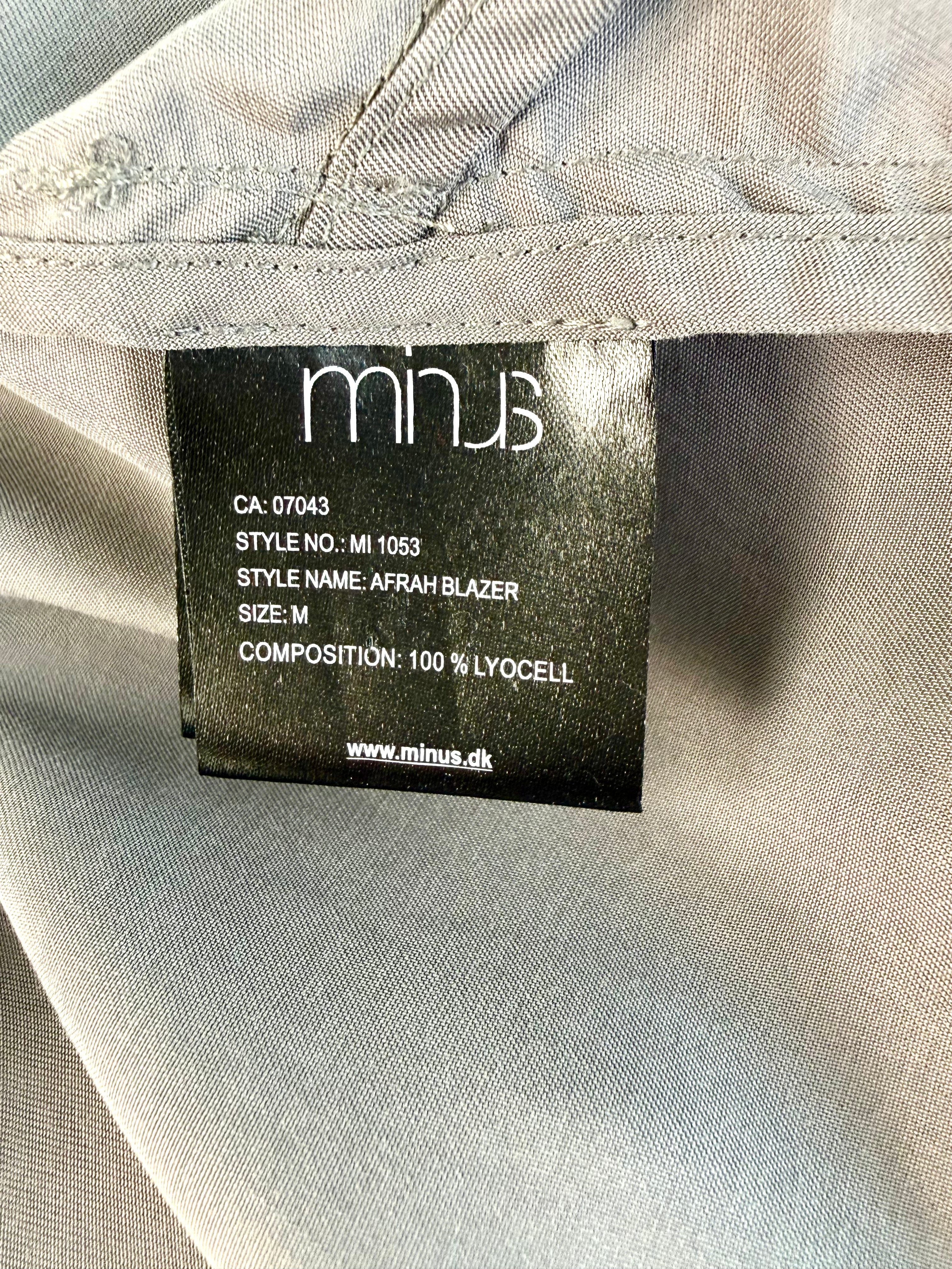 inside tag on  Minus Copenhagen Afrah Blazer|Jacket with waterfall detail in front 