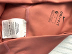 inside tag on Nike Dri-FIT Terracotta Biker Shorts | Size M  at Blue Sparrow Shop