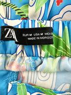inside tag on Zara blue tropical bird floral wide leg pants made in morocco
