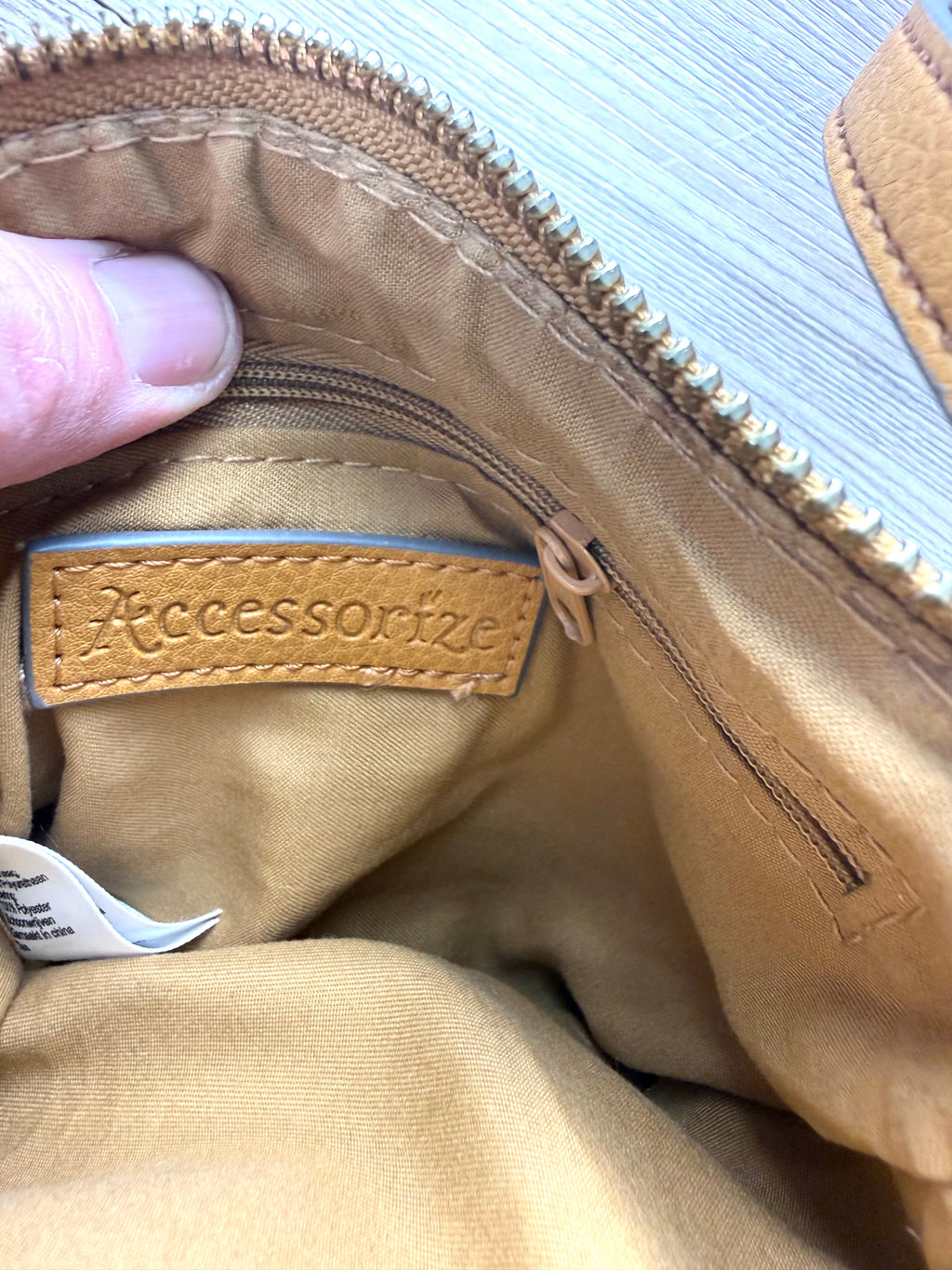 inside tag on inside of Vegan Leather Accessorize Mustard Yellow Crossbody Bag 