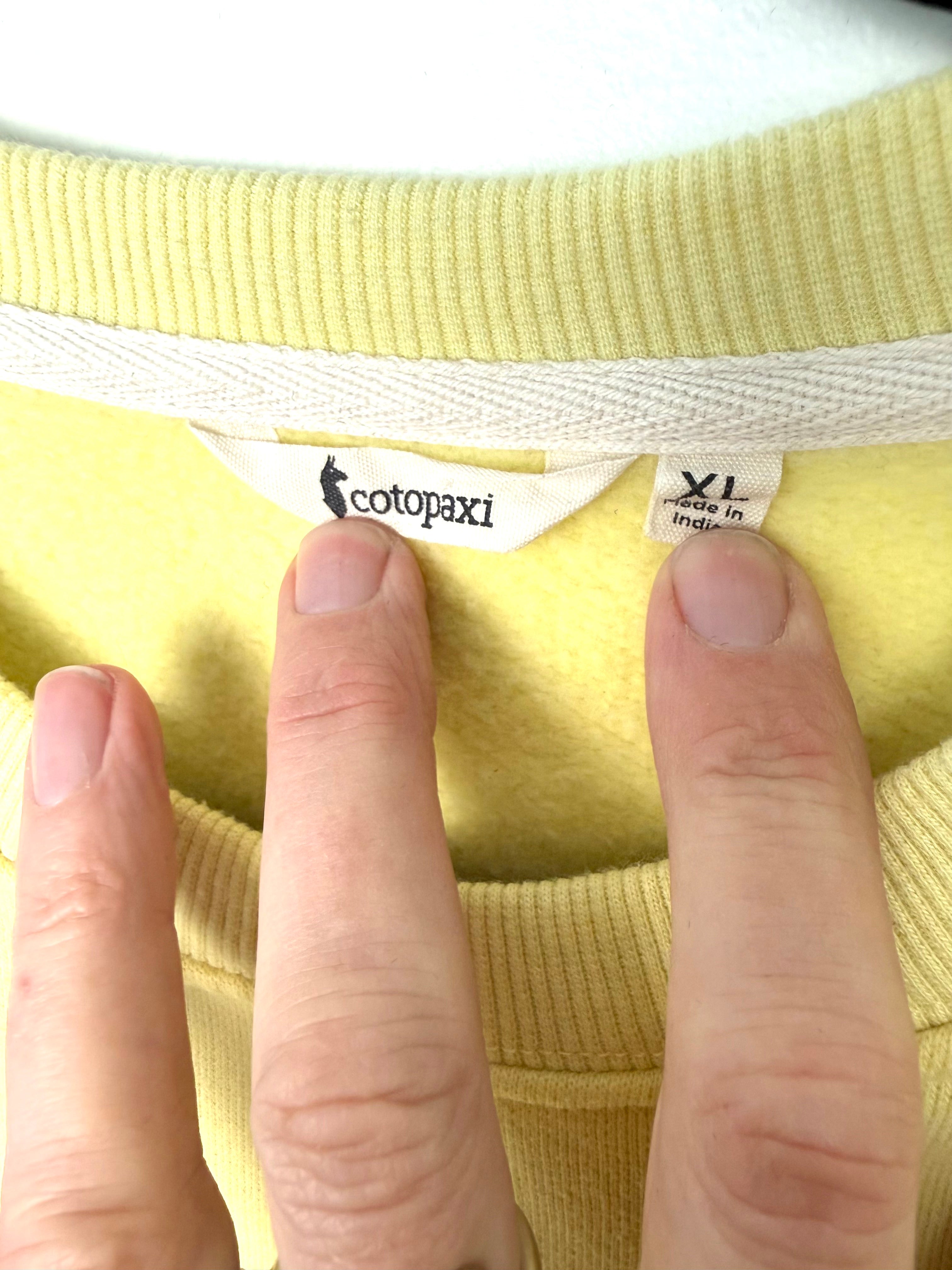 inside tag on preloved Cotopaxi Do Good sweatshirt