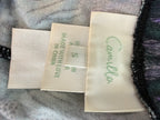 inside tag on Luxury Camilla Franks resort wear leggings featuring a vibrant animal print design with crystal embellished ankle detailing showing size small