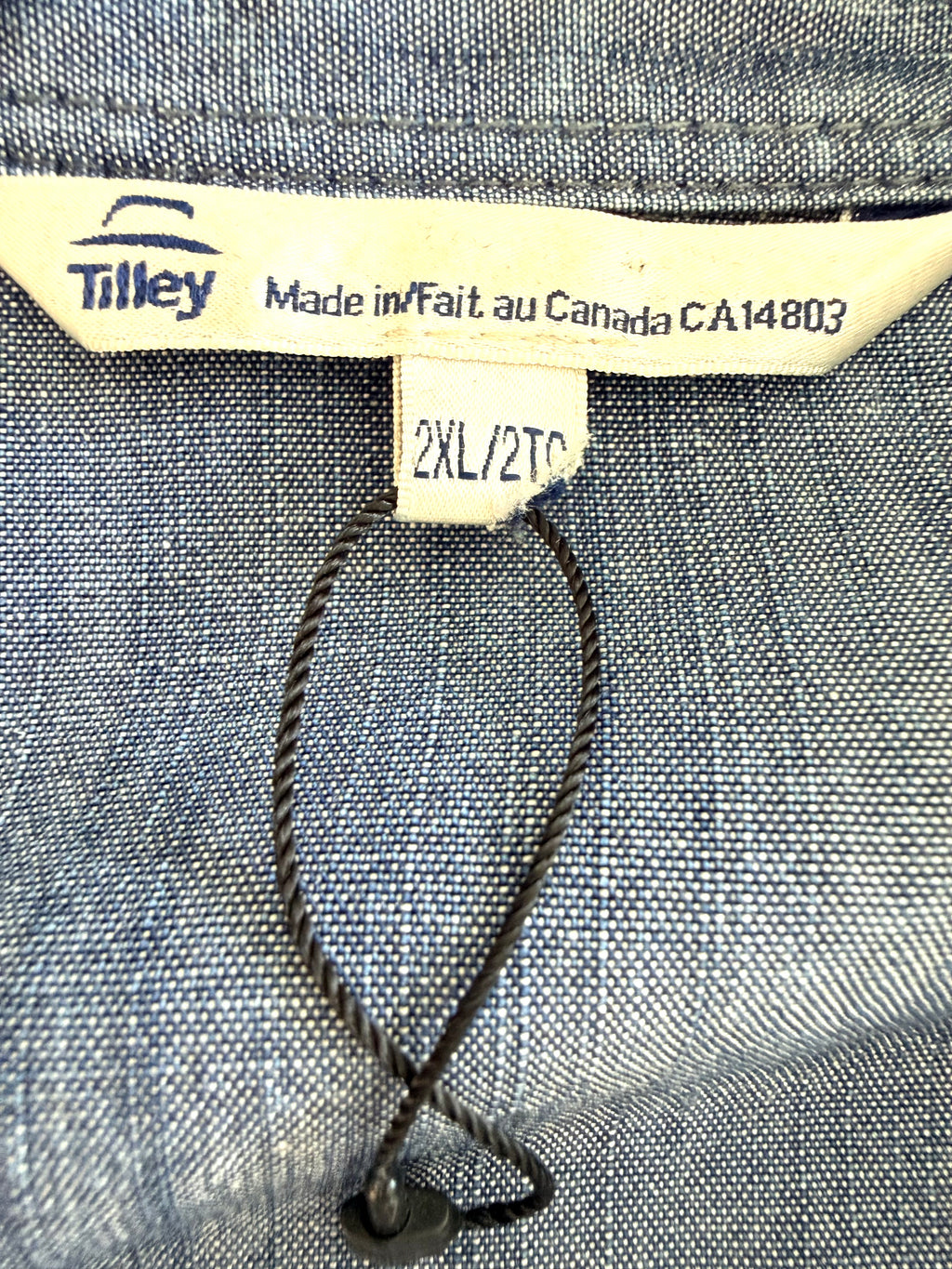 inside tag with loop from new tag on NWOT 100% Tencel Tilley Handpainted Denim Jacket | Size XXL
