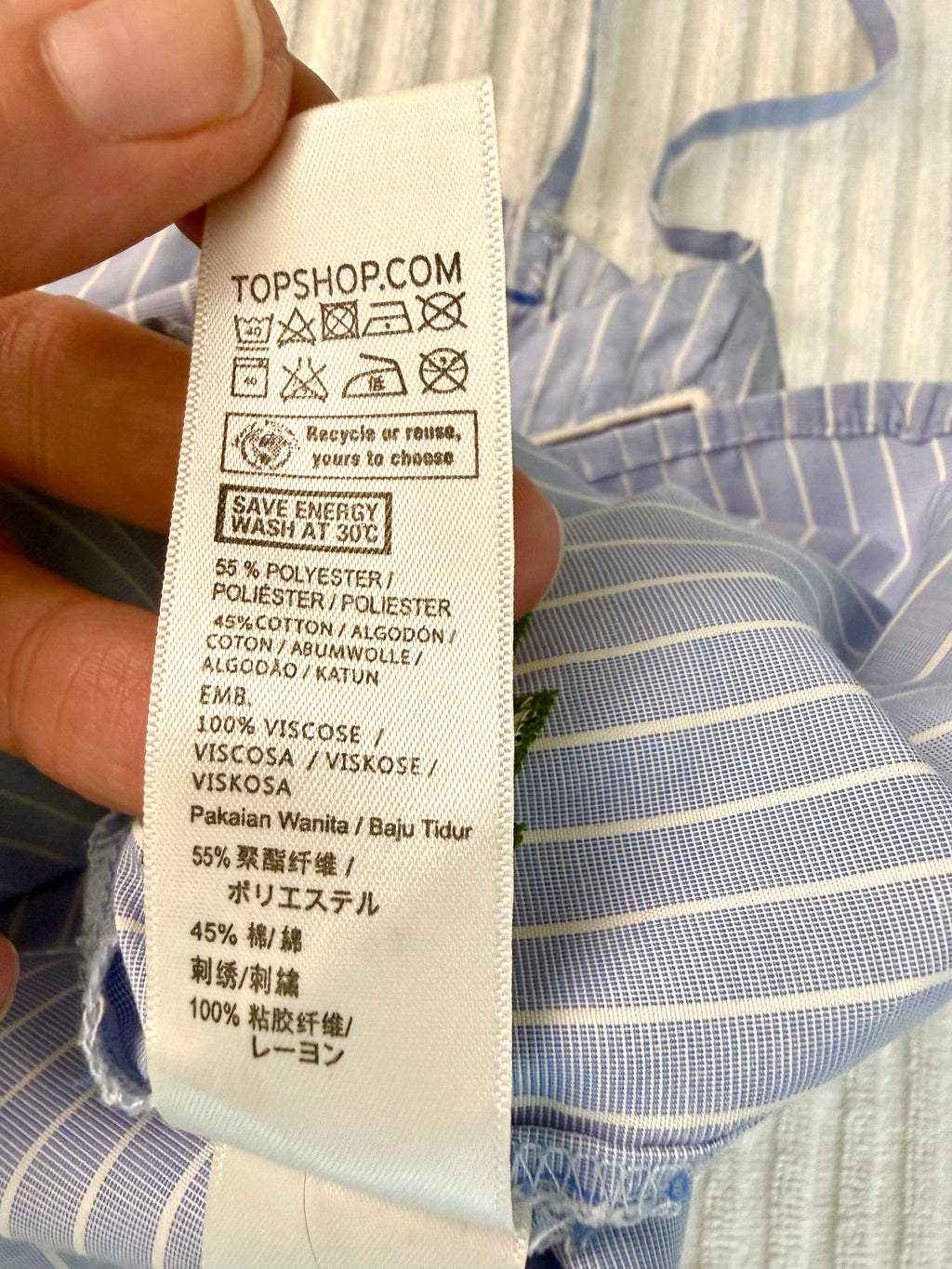 inside tags on 45% cotton  Topshop Blue Pinstripe Embroidered Cami Top | Size M at Blue Sparrow Shop  on hanger