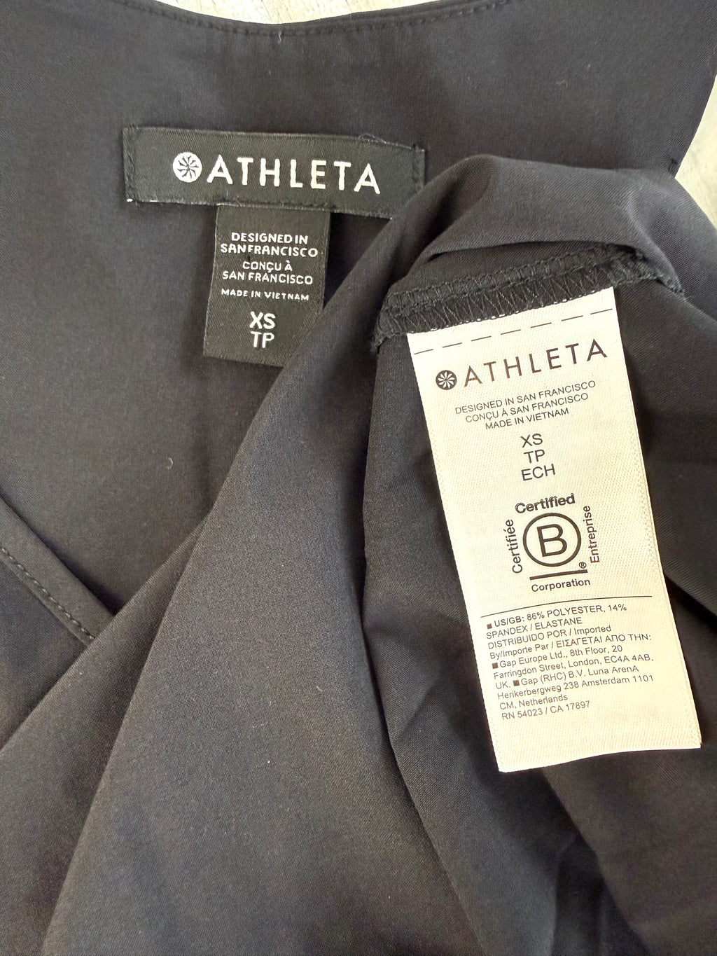 inside tags on Athleta Black Pleated Flowy Tank Top at Blue Sparrow Shop 