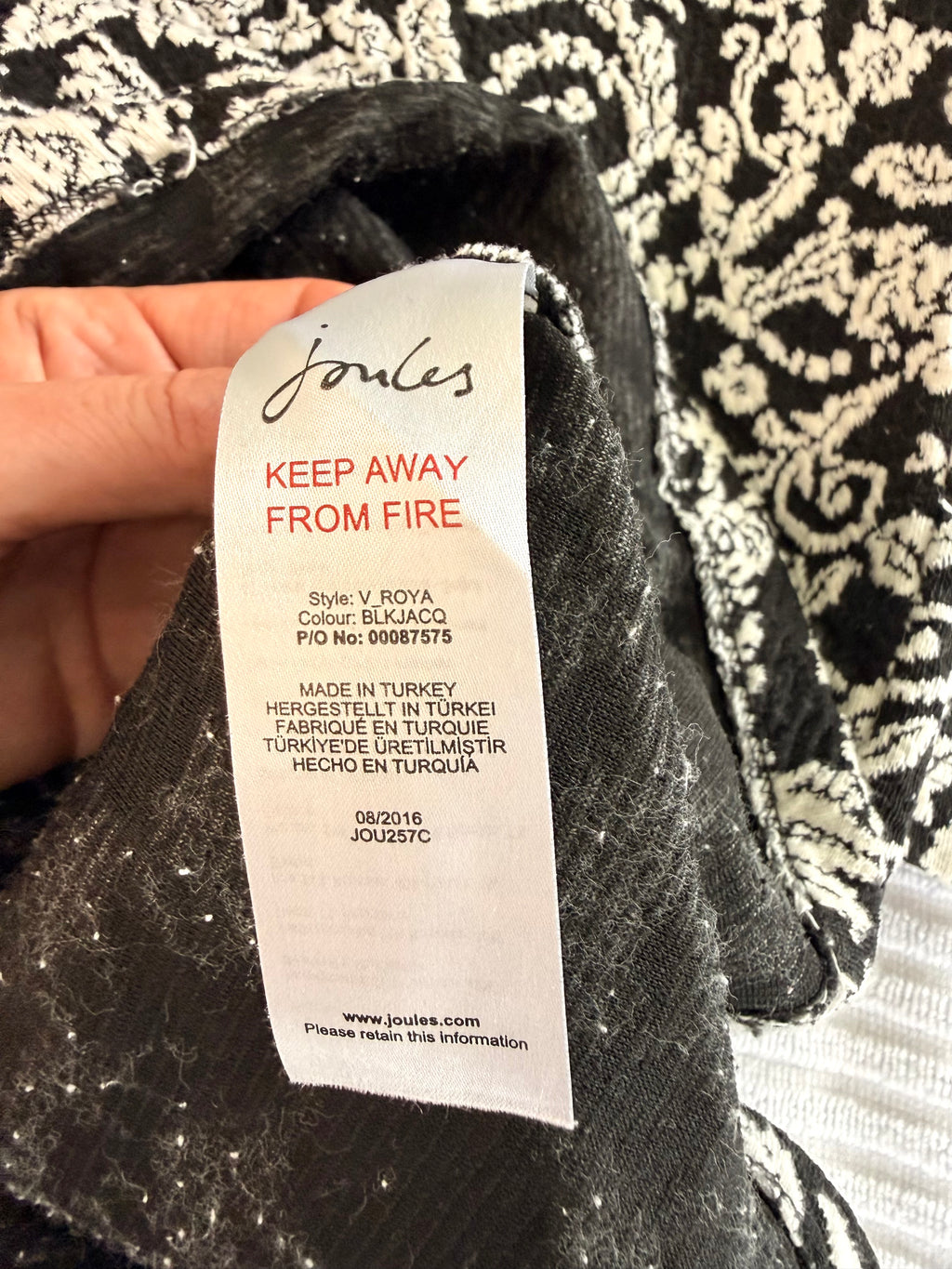 inside tags on Joules Black & Cream Floral Jacquard Tunic Dress | Size 8 measuring 16" sleeve