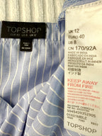 inside tags on  Topshop Blue Pinstripe Embroidered Cami Top | Size M at Blue Sparrow Shop  on hanger