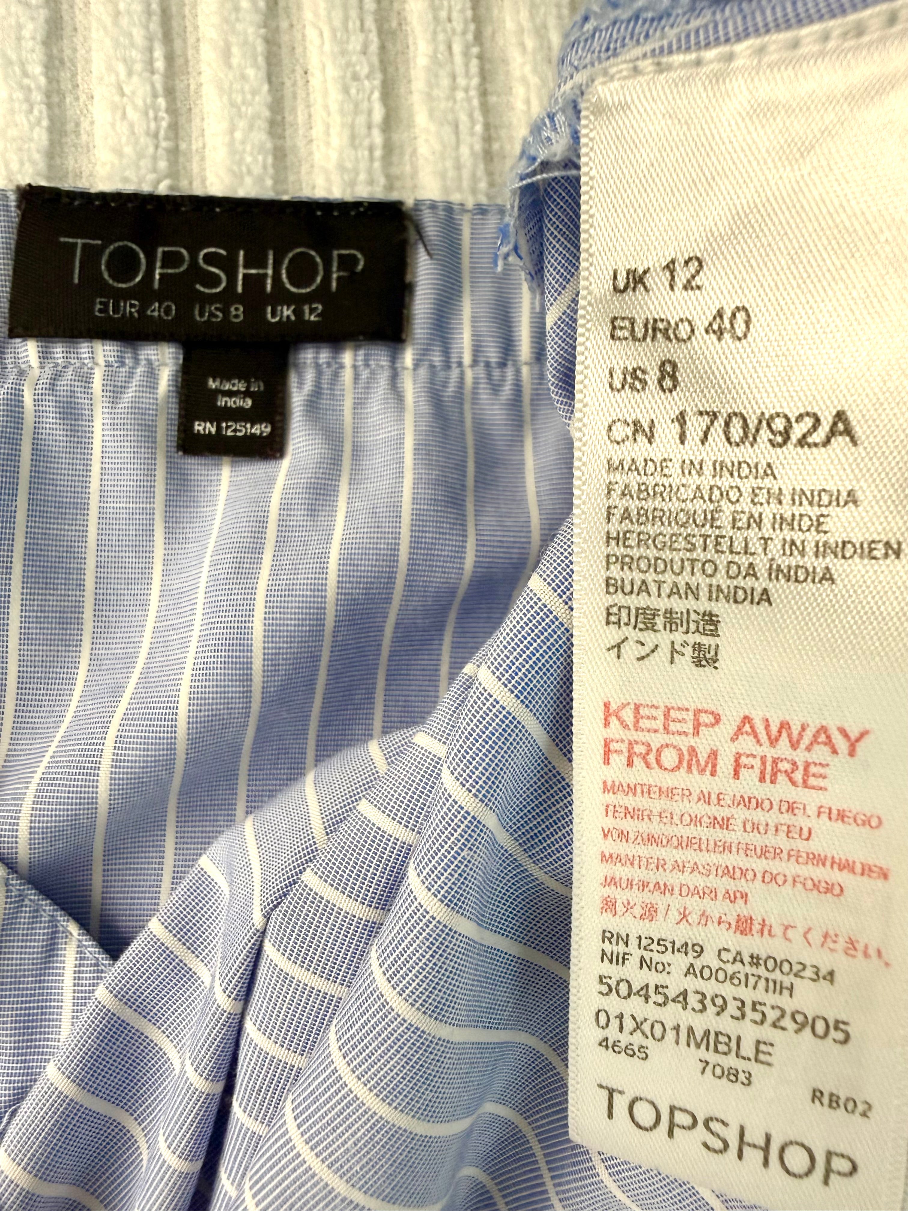 inside tags on  Topshop Blue Pinstripe Embroidered Cami Top | Size M at Blue Sparrow Shop  on hanger