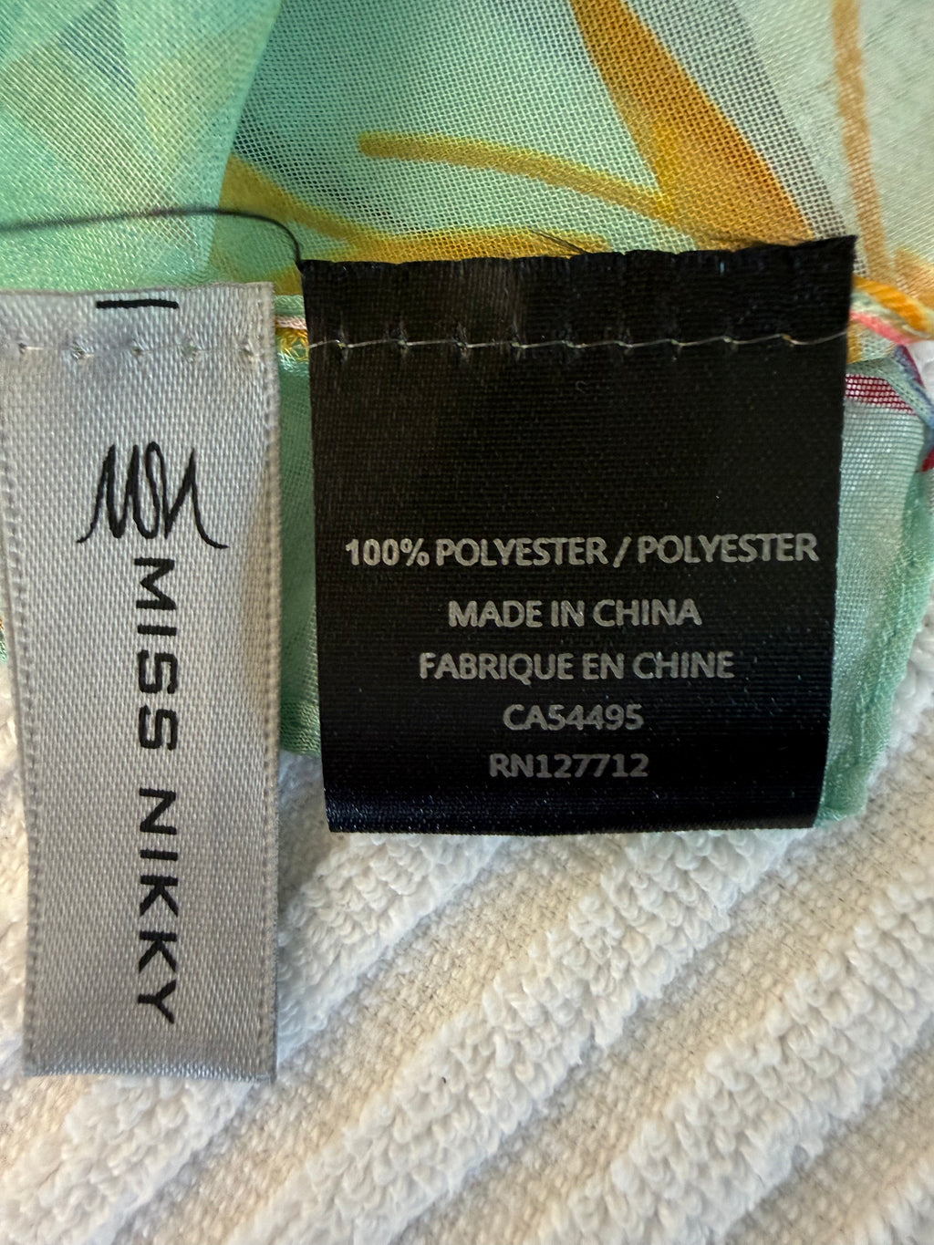inside tags on Tropical Sheer Wrap | Cover-Up | One Size at Blue Sparrow Shop