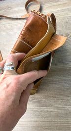 inside the back pocket on intage Hand-Tooled Leather Crossbody Bag at Blue Sparrow Shop