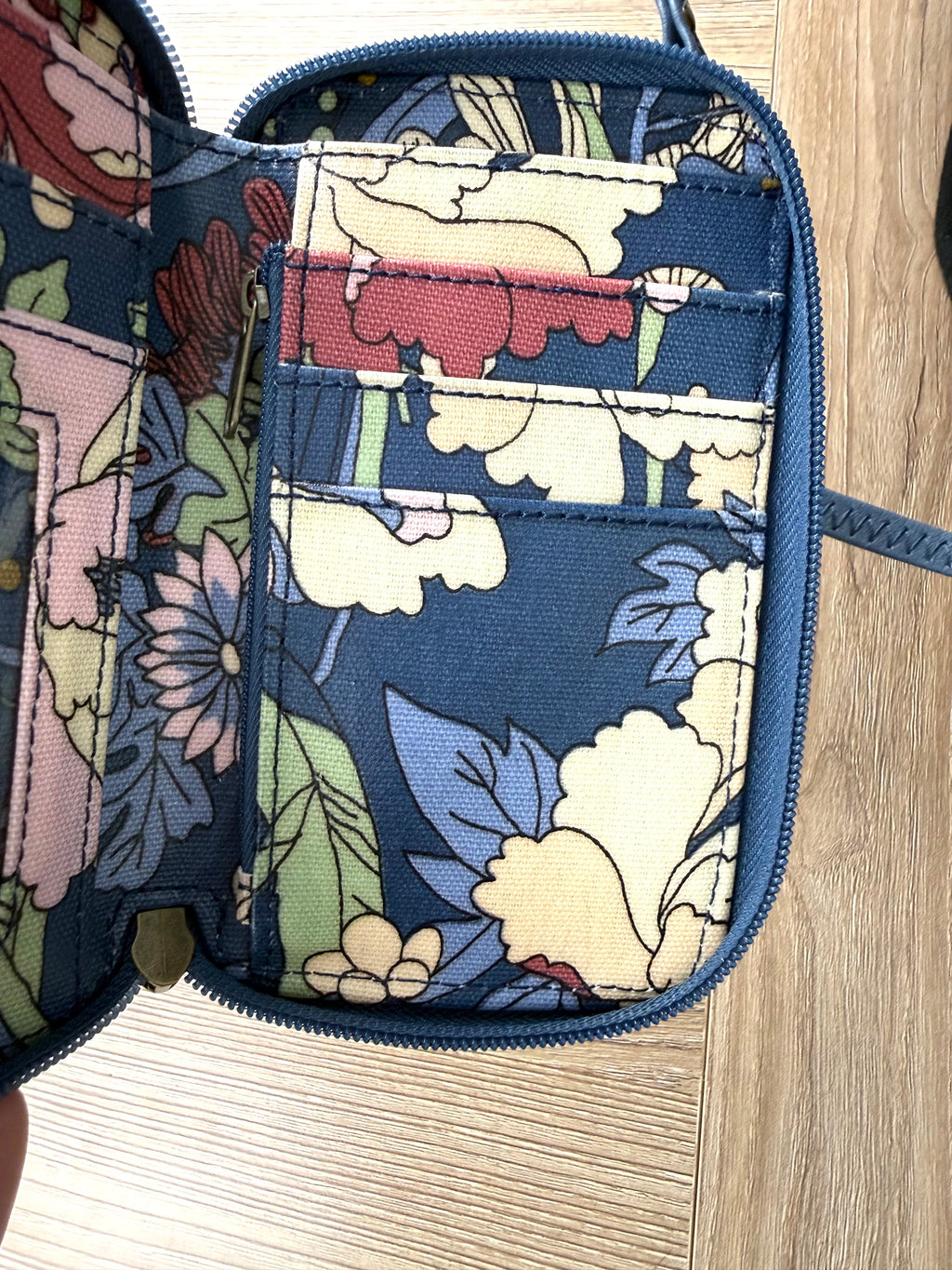 inside with zipper and card slots on Sakroots Floral Crossbody Phone Wallet 